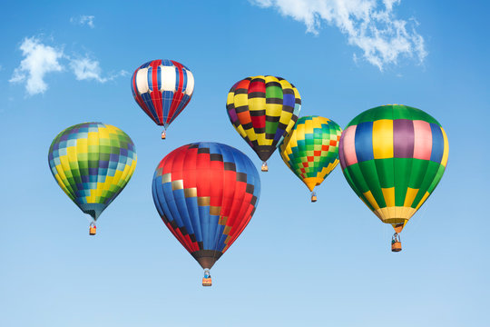 Hot air balloons up in the blue sky