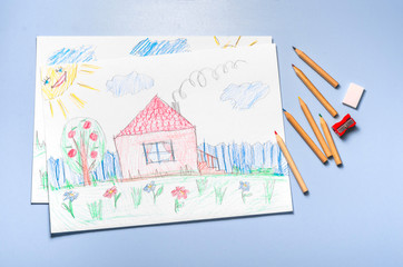 Children's drawing and color pencils top view