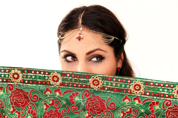Woman dancing Indian dance in national dress. A handsome beautiful girl portrait in red Hindu...