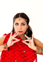 Woman dancing Indian dance in national dress. A handsome beautiful girl portrait in red Hindu...