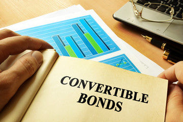 Book with page about convertible bonds. - obrazy, fototapety, plakaty