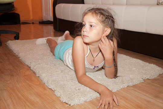 cute girl lies on the floor