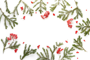 Fototapeta na wymiar Christmas background. Fir branches isolated on white background. Christmas tree. Christmas toys, snow, fir, rowan in frost, top view. Composition of fir branches, pattern. Christmas frame.