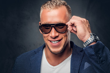 Obraz premium Studio portrait of a male dressed in a blue suit.