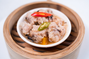 Meat balls with tomato sauce and wooden spoon, close-up