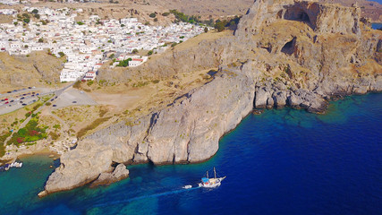Aerial drone photo of iconic ancient Acropolis and village of Lindos, Rodos island, Aegean,...