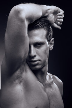 Caucasian one young adult man, muscular fitness model, head face headshot, head and shoulders shot, side view, black background studio, monochrome, black and white, close up,