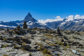 Scenic view of Matterhorn between rocks, Swiss Alps, Switzerland