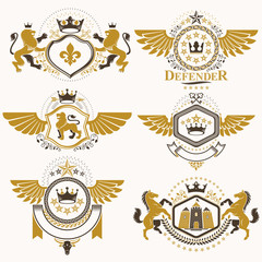 Heraldic vector signs decorated with vintage elements, monarch crowns, religious crosses, armory and animals. Set of classy symbolic graphic insignias with bird wings.