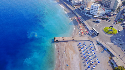 August 2017: Aerial drone photo of Rodos town peninsula with famous resorts and turquoise clear...