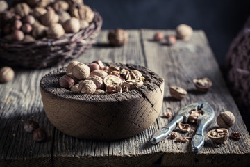 Delicious various nuts with with old nutcracker