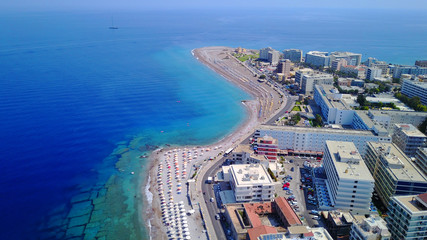 August 2017: Aerial drone photo of Rodos town peninsula with famous resorts and turquoise clear...