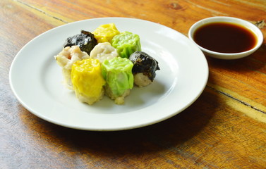 steamed Chinese dim sum eat couple with soy sauce