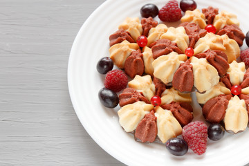Christmas still life with cake with fresh berries on white plate. Selective focus