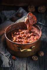 Tasty chocolate with hazelnuts, almonds and walnuts
