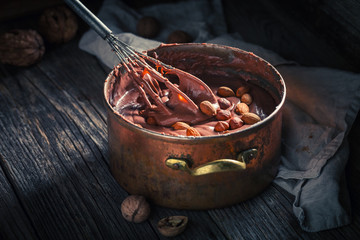 Sweet chocolate with hazelnuts, almonds and walnuts