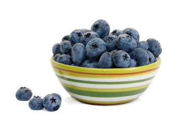 Closeup  blueberry in striped ceramic cup  on white background isolated