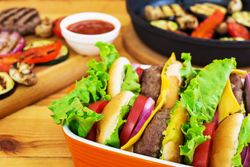 Grilled vegetables and handmade burger. Zucchini, eggplant, mushrooms, pepper on the grill. Top view