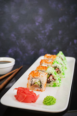 Sushi roll on dark background