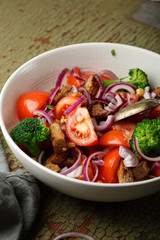 Red tomatoes salad with broccoli