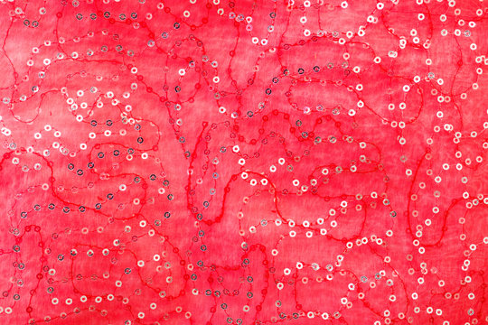 r&ouml;tt tyg med paljetter bakgrund