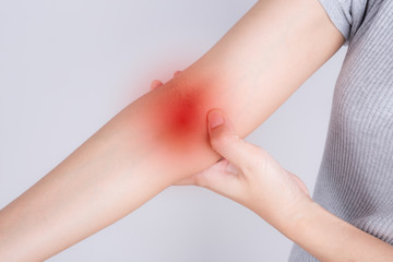 asian woman with elbow pain,extensor carpi radialis brevis