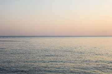 Fototapeta na wymiar Calm Blue sea waves soft surface Ocean And Blue Sky Background