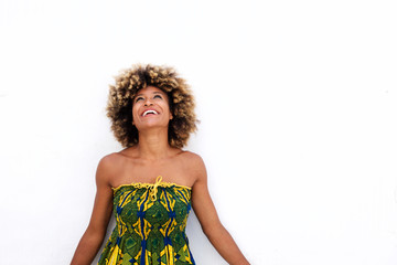 African american female in sun dress standing on white background