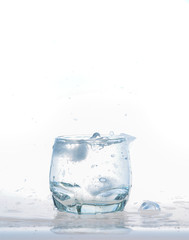 cool water, Ice cubes splashing into glass of water, water splashing from ice cubes being dropped in a glass.