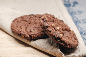 Pastry biscuits on linen napkin on wooden table