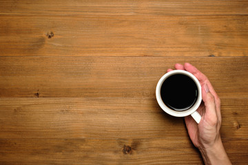 Male hands holding cups of coffee