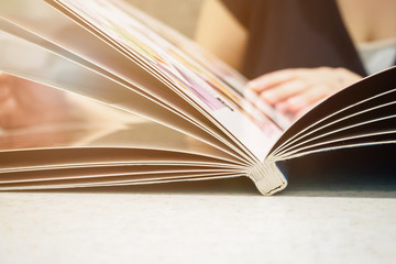 Beautiful young asian woman with menu in restaurant