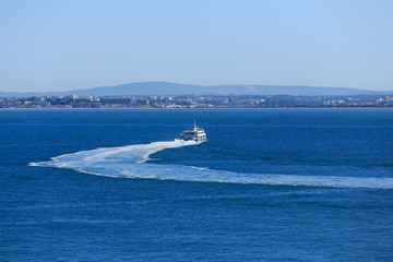 Naklejka premium Ferry Cruising Away in Lisbon