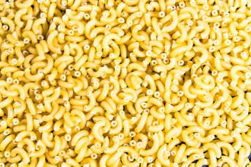yellow not baked pasta background