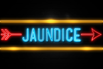 Jaundice  - fluorescent Neon Sign on brickwall Front view