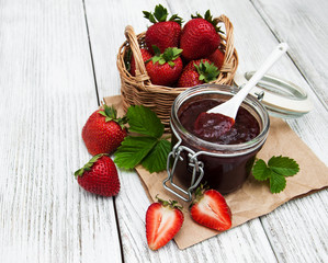 Strawberry jam and fresh strawberries
