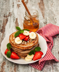 Pancakes with strawberries and bananas