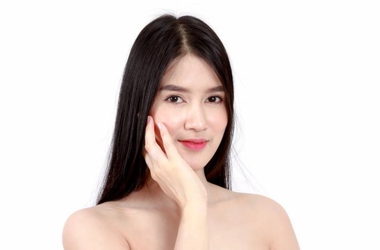 Young Asian woman touching her face and smile