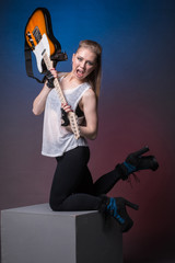 Girl with guitar at the rehearsal before the performance