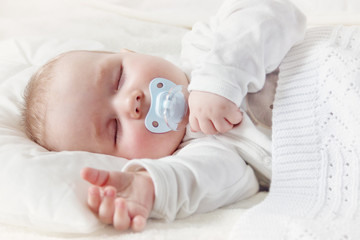 Baby sleeping covered with soft blanket