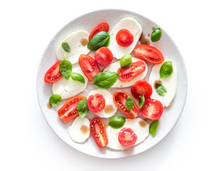 salad caprese with buffalo mozzarella and sliced tomatoes, avocado and cucumber