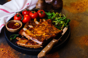 Grilled pork ribs with vegetables. Copy space
