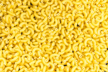 yellow not baked pasta background