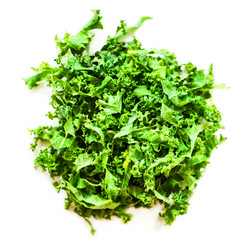 Fresh green kale salad leaves  on white  background.