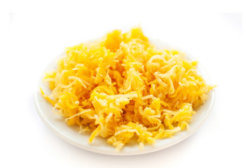 Heap of grated cheese  isolated on white background, macro image top view image.