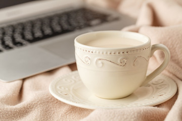 cozy tea-drinking tea with milk and a warm blanket
