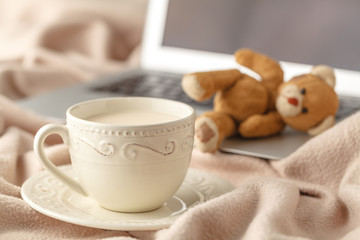 cozy tea-drinking tea with milk and a warm blanket
