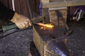 Incandescent iron in an old metal forge