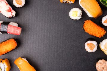 Top view of Sushi set on black background, Japanese food. Free space for text