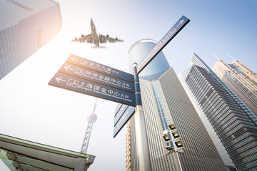 the modern building with airliner at dusk in shanghai, China.